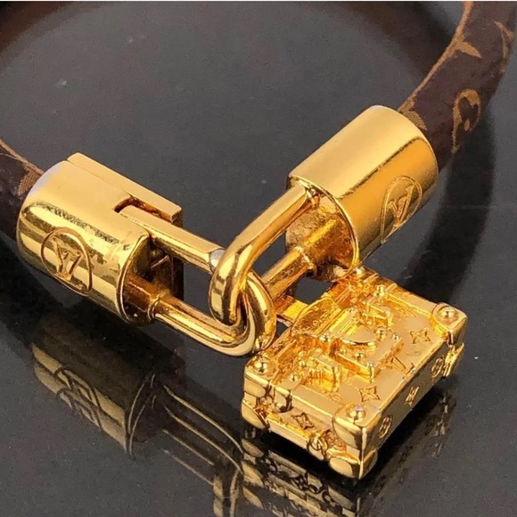 Louis Vuitton Jewelry - Louis Vuitton luxury bracelet with adorable luggage charm!!